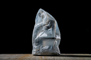 close up of a microscope covered with plastic