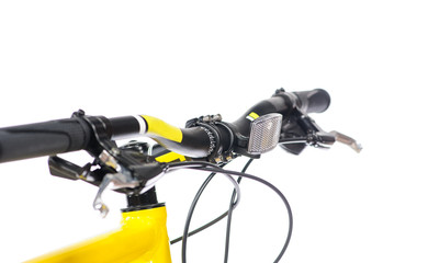 Parts of yellow bicycle on a studio white background. Close up details