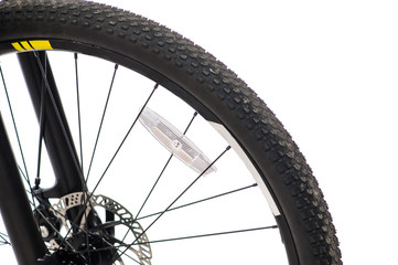 Fototapeta premium Parts of yellow bicycle on a studio white background. Close up details