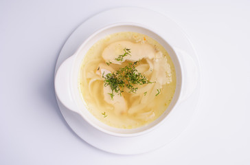 Chicken soup bouillon in a plate