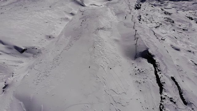 two skiers going down volcano villarrica 