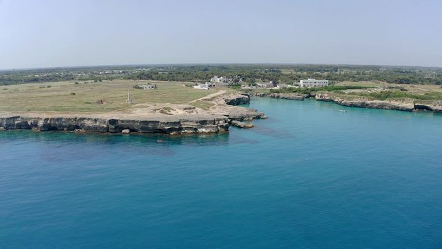 Aerial view, flight at Tower and bay of Roca Vecchia (Torre di Maradico), archaeological sites, Brindisi region, Apulia Italy
