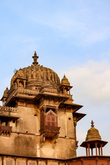 Ornate dome roofs of the Orchha Palace in sunset, Orchha, India