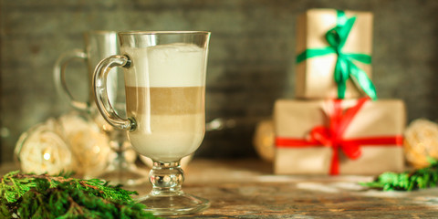 Coffee with milk and gifts on the table - festive atmosphere, (latte) New Year and Christmas. top food background. copy space