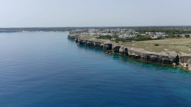 Aerial view, flight at Tower and bay of Roca Vecchia (Torre di Maradico), archaeological sites, Brindisi region, Apulia Italy