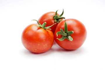 ripe fresh tomatoes isolated on white background