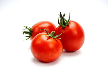 ripe fresh tomatoes isolated on white background