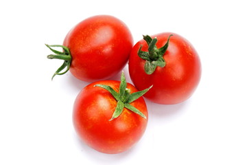 ripe fresh tomatoes isolated on white background