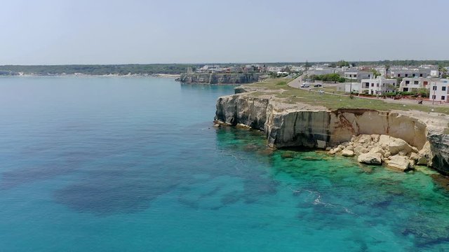 Aerial view, flight at Tower and bay of Roca Vecchia (Torre di Maradico), archaeological sites, Brindisi region, Apulia Italy