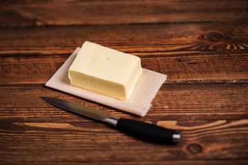 piece of butter on a wooden desk
