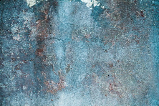 Old blue distressed wall background or texture