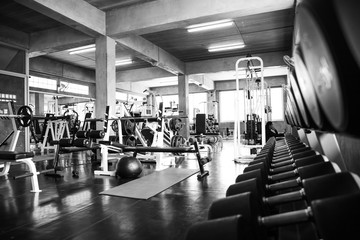 Within gym with modern fitness equipment.