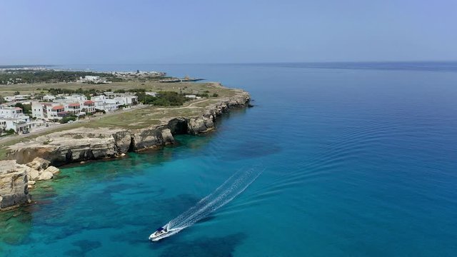 Aerial view, flight at Tower and bay of Roca Vecchia (Torre di Maradico), archaeological sites, Brindisi region, Apulia Italy