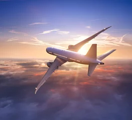 Rolgordijnen Passengers commercial airplane flying above clouds © Jag_cz