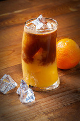 glass of orange juice whith coffee