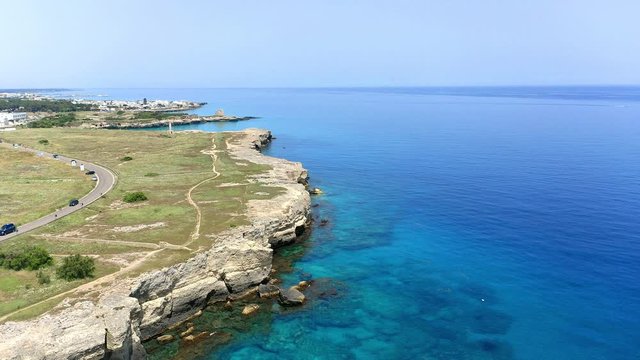 Aerial view, flight at Tower and bay of Roca Vecchia (Torre di Maradico), archaeological sites, Brindisi region, Apulia Italy