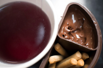 tea and sticks cookies and chocolate