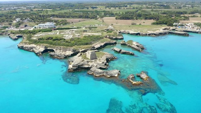 Aerial view, flight at Tower and bay of Roca Vecchia (Torre di Maradico), archaeological sites, Brindisi region, Apulia Italy