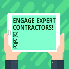 Conceptual hand writing showing Engage Expert Contractors. Business photo text Hiring skilled outworkers for a short time work Hu analysis Hand Holding Tablet Smartphone Display Unit photo