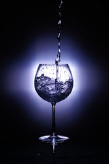 glass of water isolated on black background