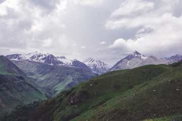 Fototapeta premium Mountains rocks landscape with cloudy dramatic sky
