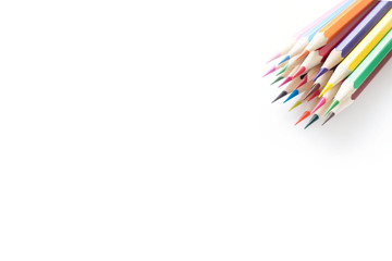 Set of school color pencils isolated on white background. Top view, flat lay composition, frame, layout. Copy space for text or design.