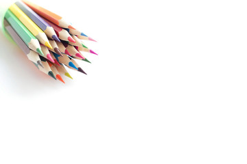 Set of school color pencils isolated on white background. Top view, flat lay composition, frame, layout. Copy space for text or design.