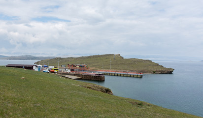 View of the ferry pier on Lake Baikal on a cloudy summer day