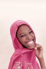 Joyful teenager wearing a pink veil for a celebration  - obrazy, fototapety, plakaty