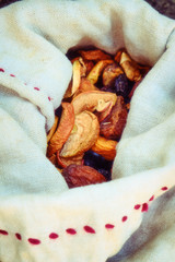 Fototapeta na wymiar Dried fruits in ancient Rome, reconstruction. Dried goji berries in burlap bag, lifestyle.