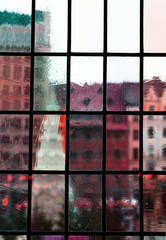 blur red pink green classic building city view from interior classic transparent glass window architecture background