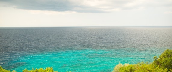 Blue sea and white cloudy sky in an area in Greece Halkidiki  © lostintimeline