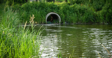 Pipe or tube for water sewer leading into the river.