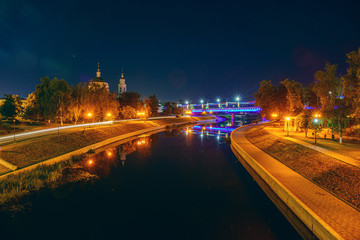 Fototapeta na wymiar Oryol or Orel city embankment in night, Russia. Oka river with reflected of illuminated historic and religious buildings