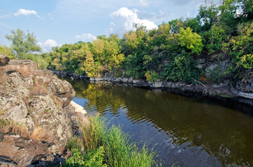 Fototapeta na wymiar Stone cliff on the river bank
