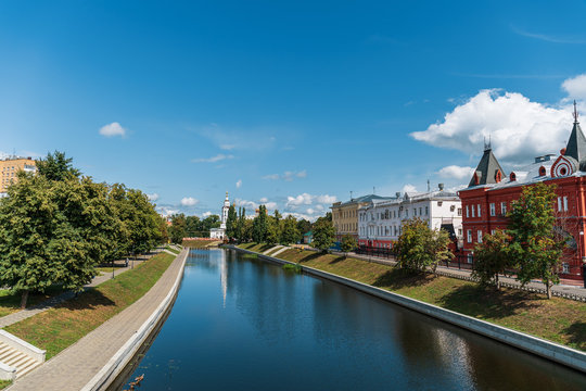 Oryol or Orel city embankment in summer day, Russia. Oka river and historic and religious buildings