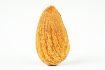 One almond nut isolated on white background close-up macro