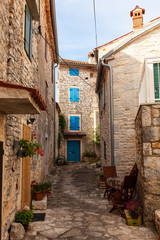 Fototapeta na wymiar View of typical istrian alley in Villa - Bale, Croatia