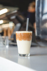 Iced Coffee in a glass, vertical shot, dark background