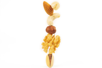 Almond, Cashew, Hazelnut, Walnut and Pistachio are isolated on a white background
