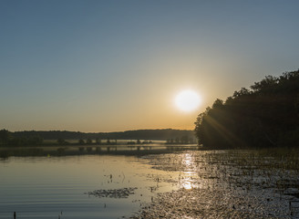 sunrise over the lake on a summer day