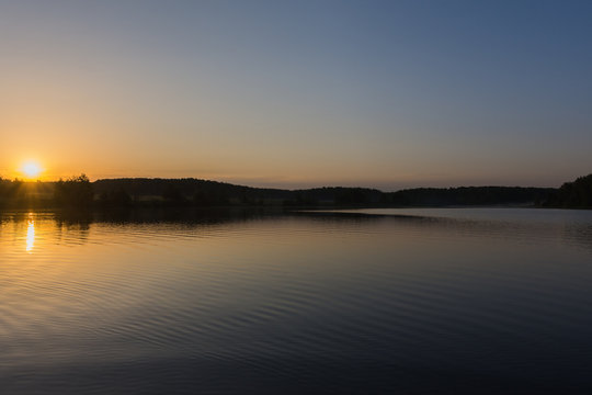 sunrise over the lake on a summer day © ILIA