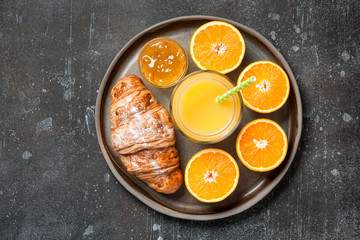 Fresh oranges and glass of juice