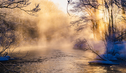 sunrise over cold river with beautiful fog