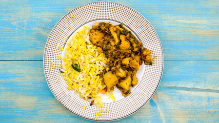 Indian Style Vegetarian Aloo Gobi Saag With Rice