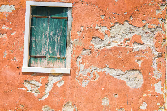 old dirty red wall and window