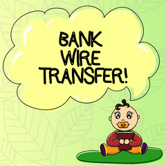 Fototapeta premium Word writing text Bank Wire Transfer. Business concept for money goes from one bank or credit another using network Baby Sitting on Rug with Pacifier Book and Blank Color Cloud Speech Bubble