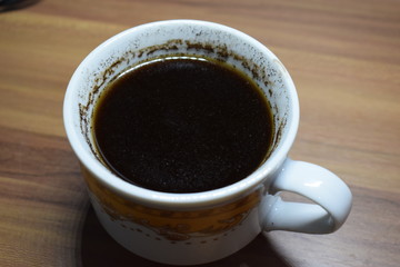 Man Holding A Cup Of Coffee