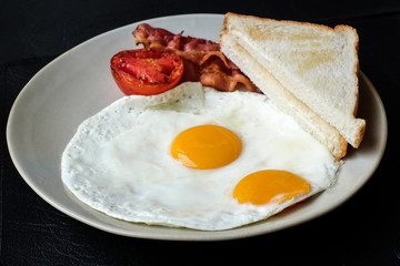 eggs with bacon and bread for breakfast