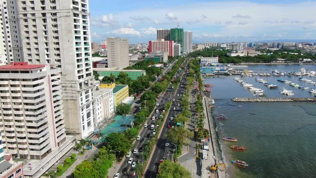 A nice aerial view of Roxas Boulevard has a front and center view of the world famous Manila sunset and the view of classy yatch parked in front of the seafront Manila Yatch Harbor.